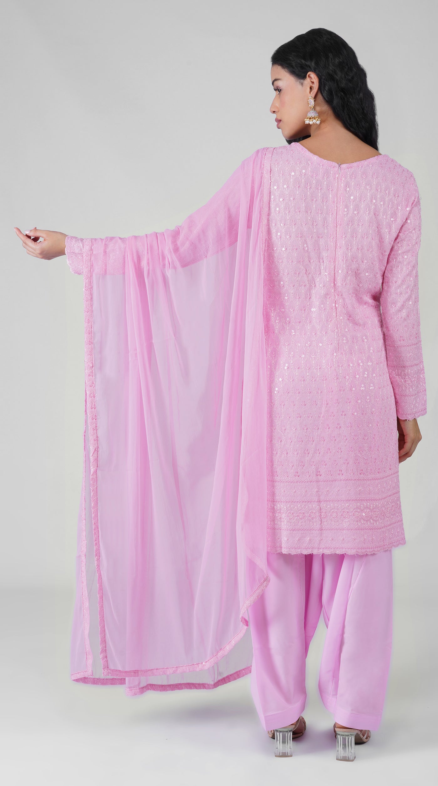 Side profile of pink Chikankari rayon suit with chiffon dupatta
