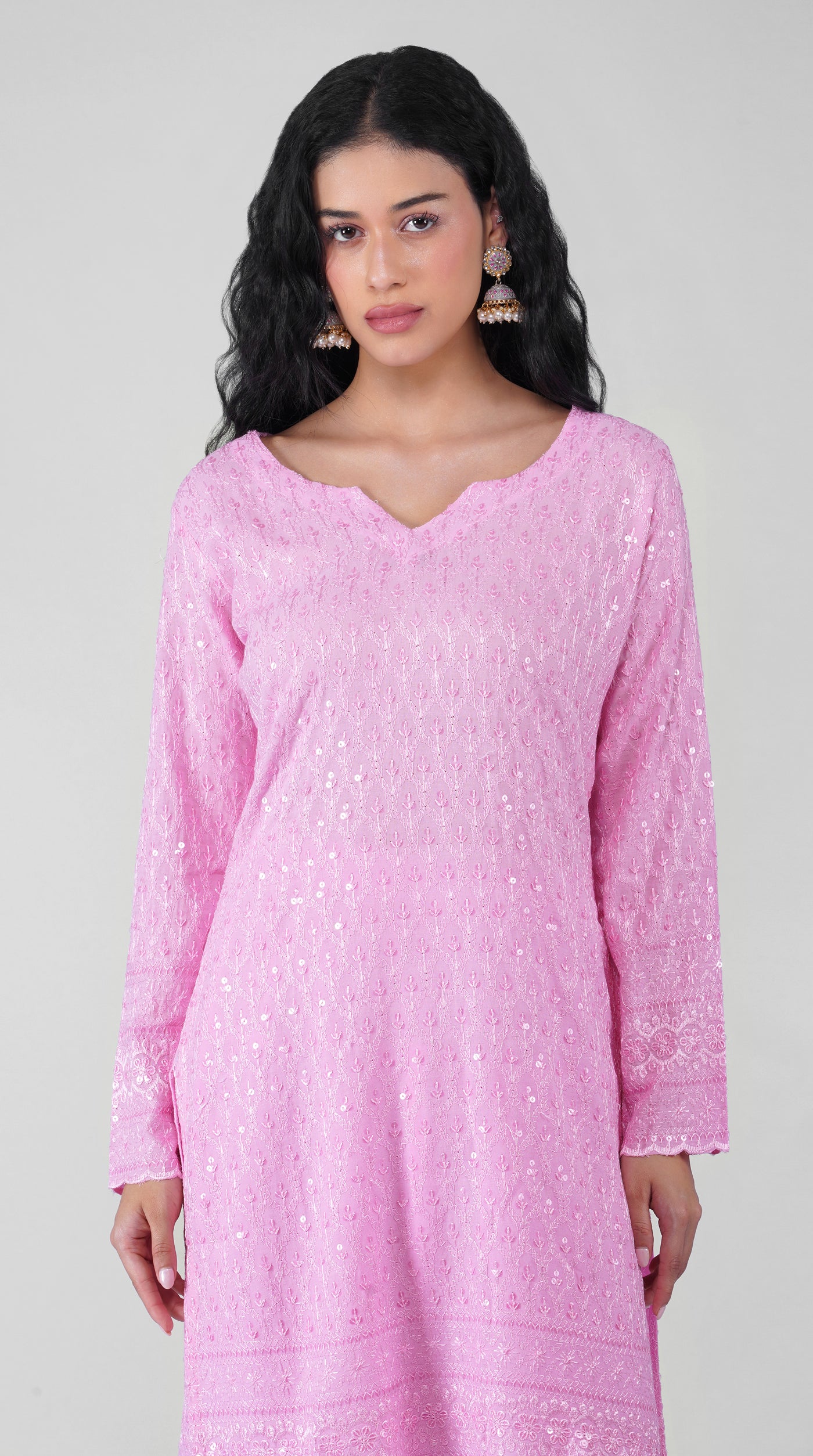 Close-up of pink Chikankari embroidery on rayon kurta