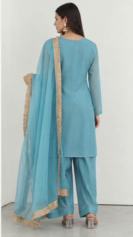 Blue printed georgette salwar suit styled with gold fringe organza dupatta