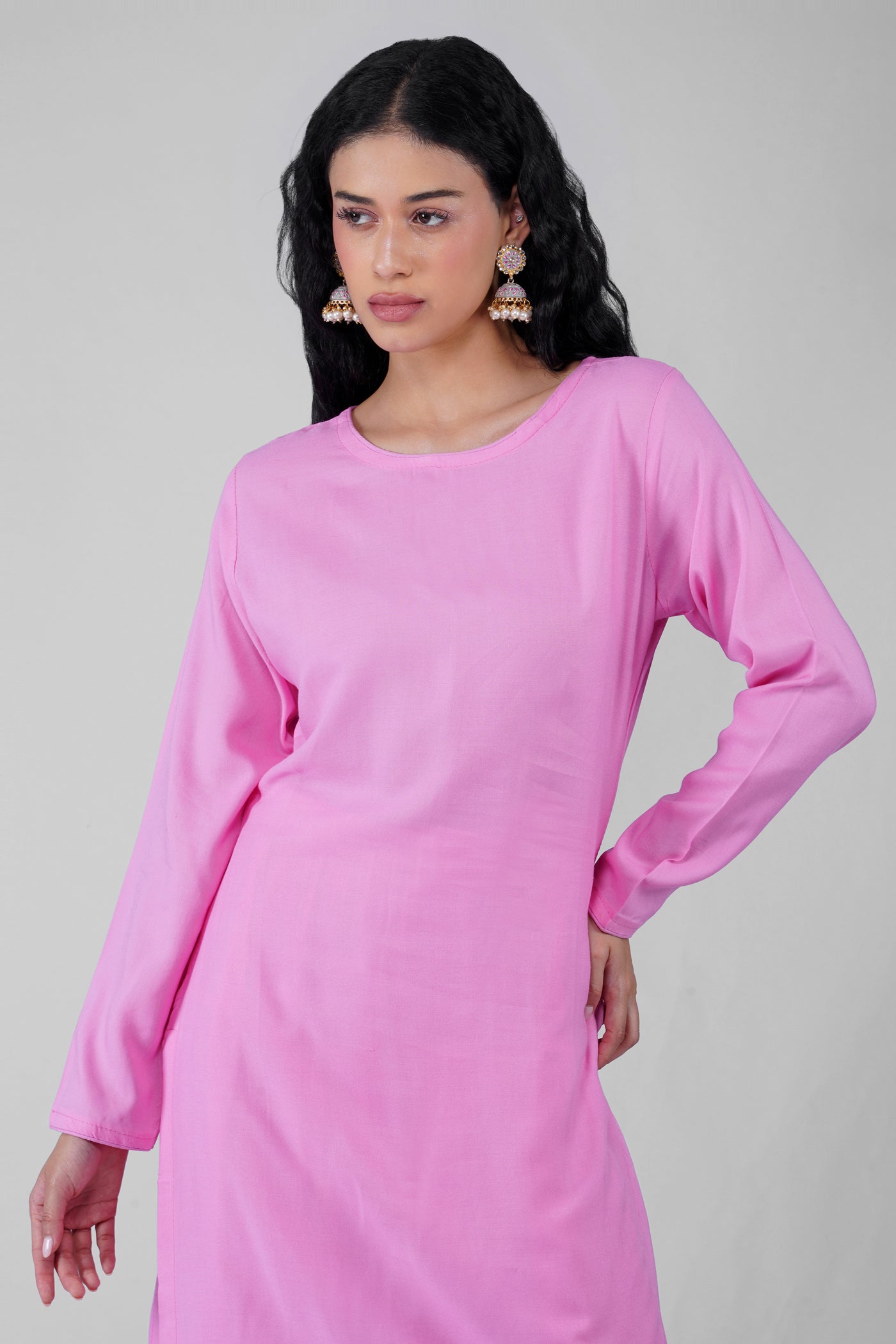 Side profile of plain pink rayon suit with chiffon dupatta
