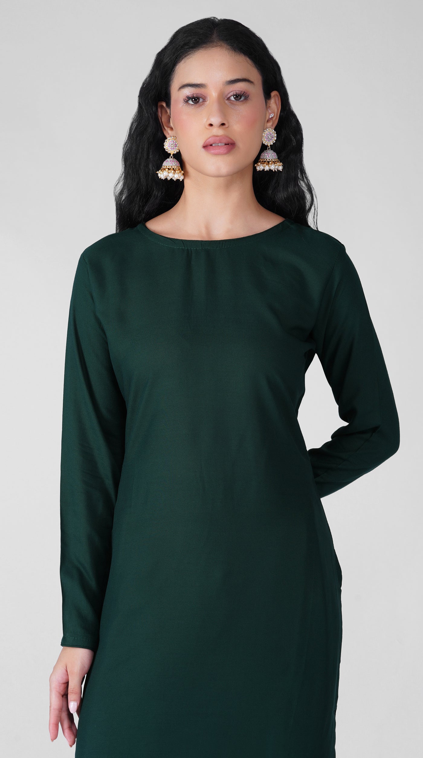 Side profile of dark green rayon suit with chiffon dupatta