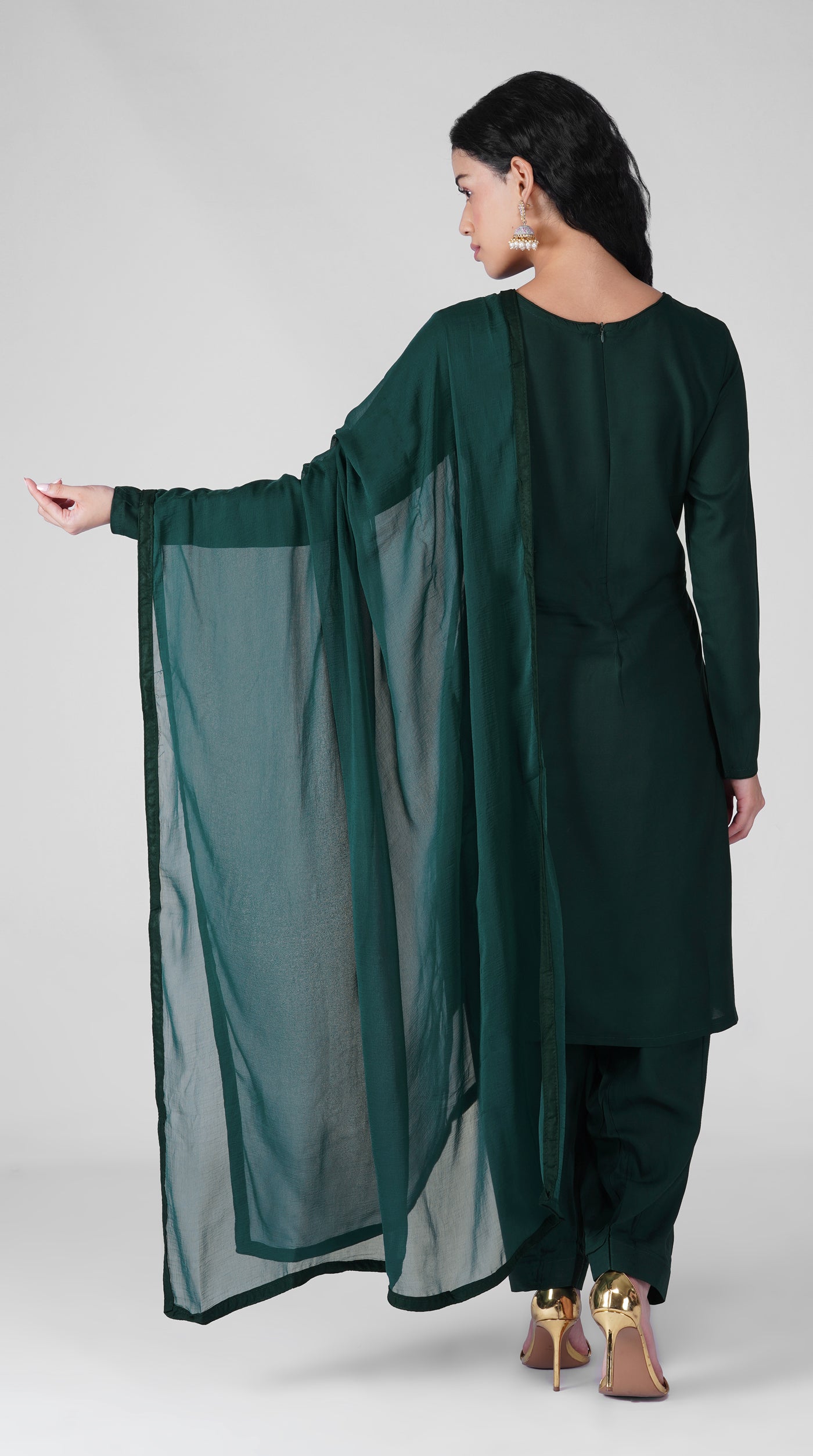 Close-up of plain dark green rayon kurta and neckline