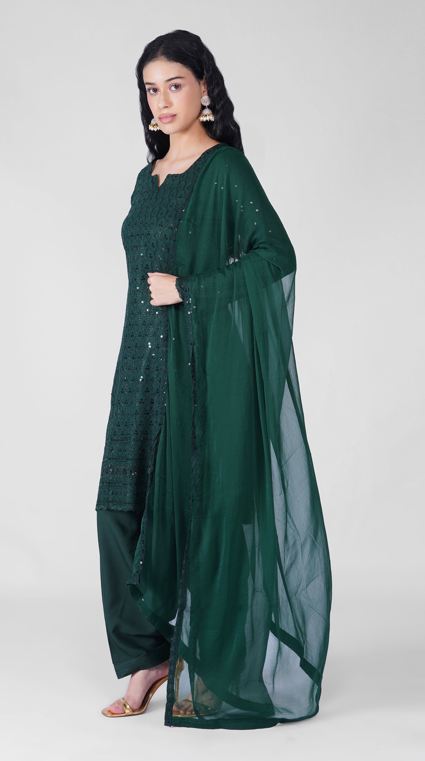 Front view of dark green Chikankari embroidered rayon suit