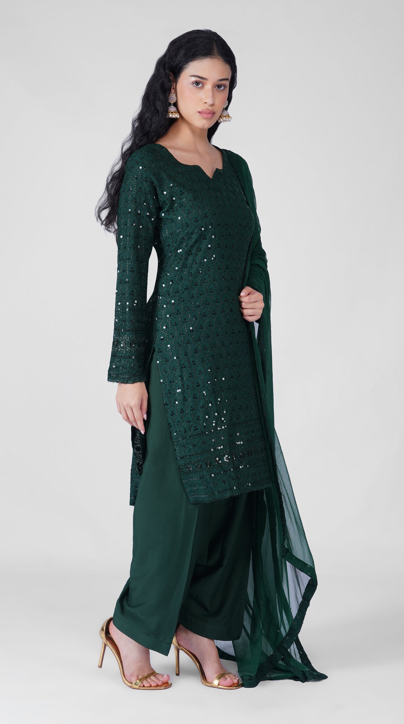 Dark green rayon suit featuring delicate Chikankari embroidery