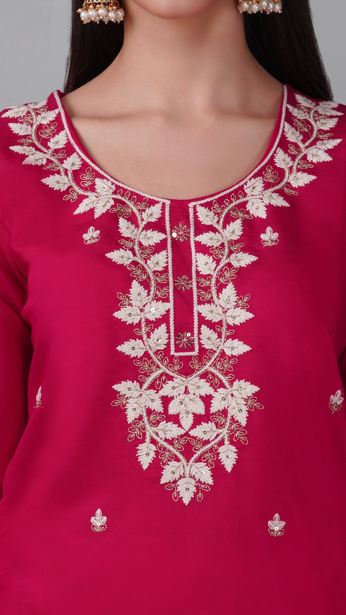 Pink threadwork kurta set paired with white trousers and dupatta