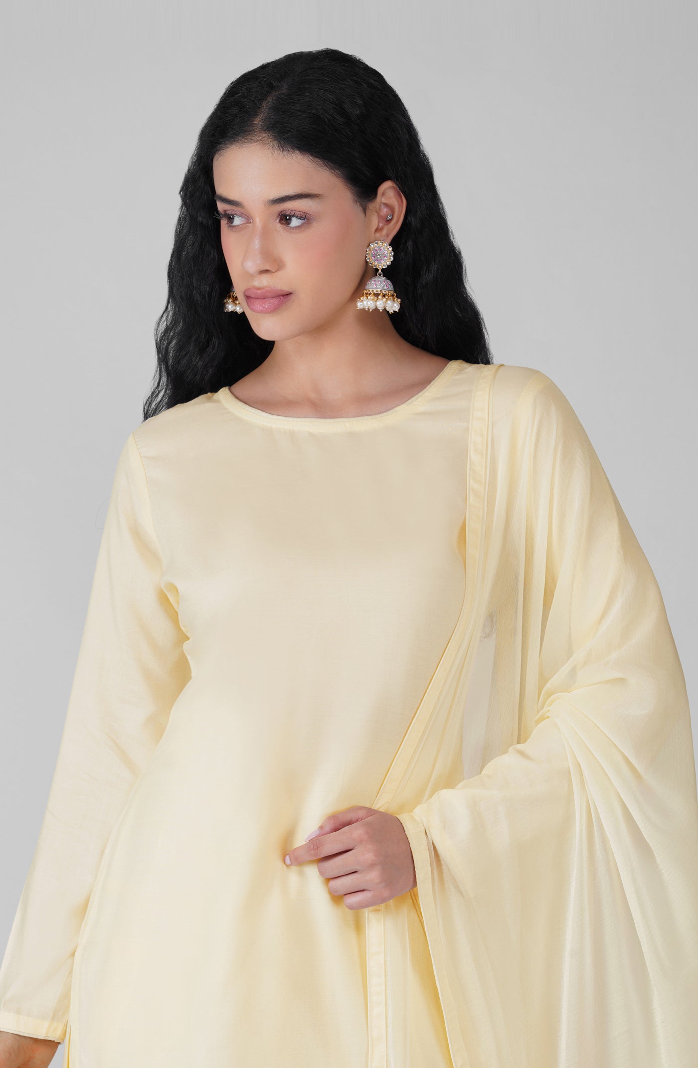 Close-up of plain ivory rayon kurta and neckline