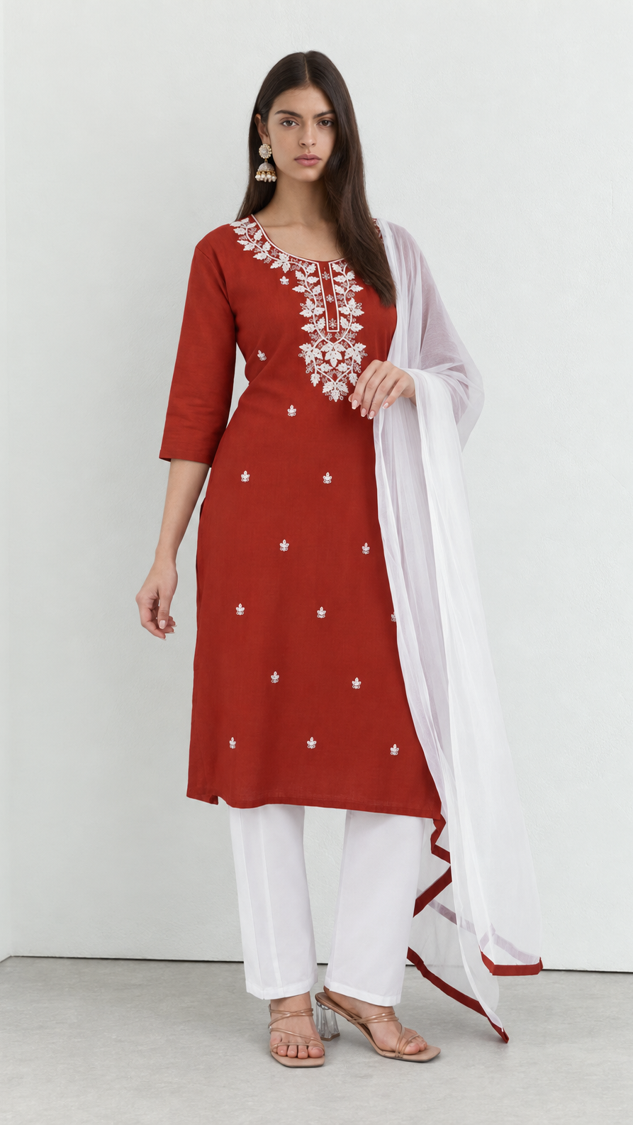 Rust cotton kurta suit with detailed threadwork and white trousers