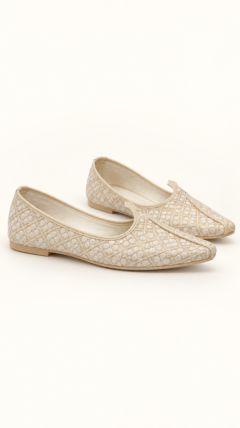 A pair of brocade jutti with a textured, quilted chevron pattern, displayed on a clean off-white background.