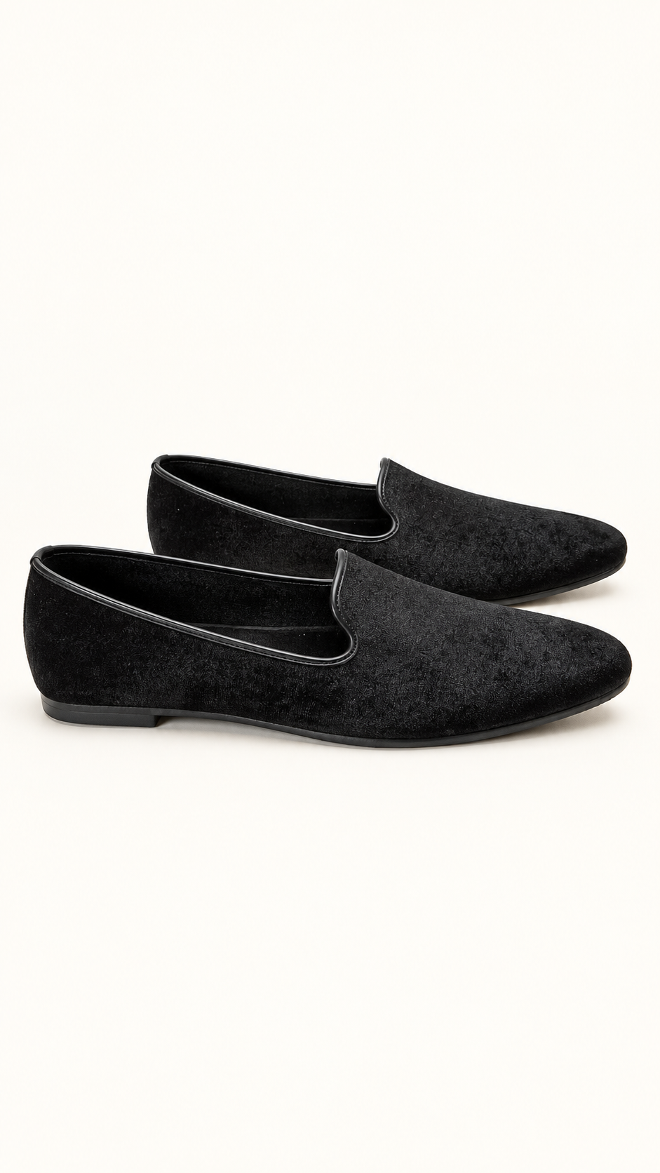 A pair of black Velvet slip-on loafers with a pointed toe, displayed on a clean white background.