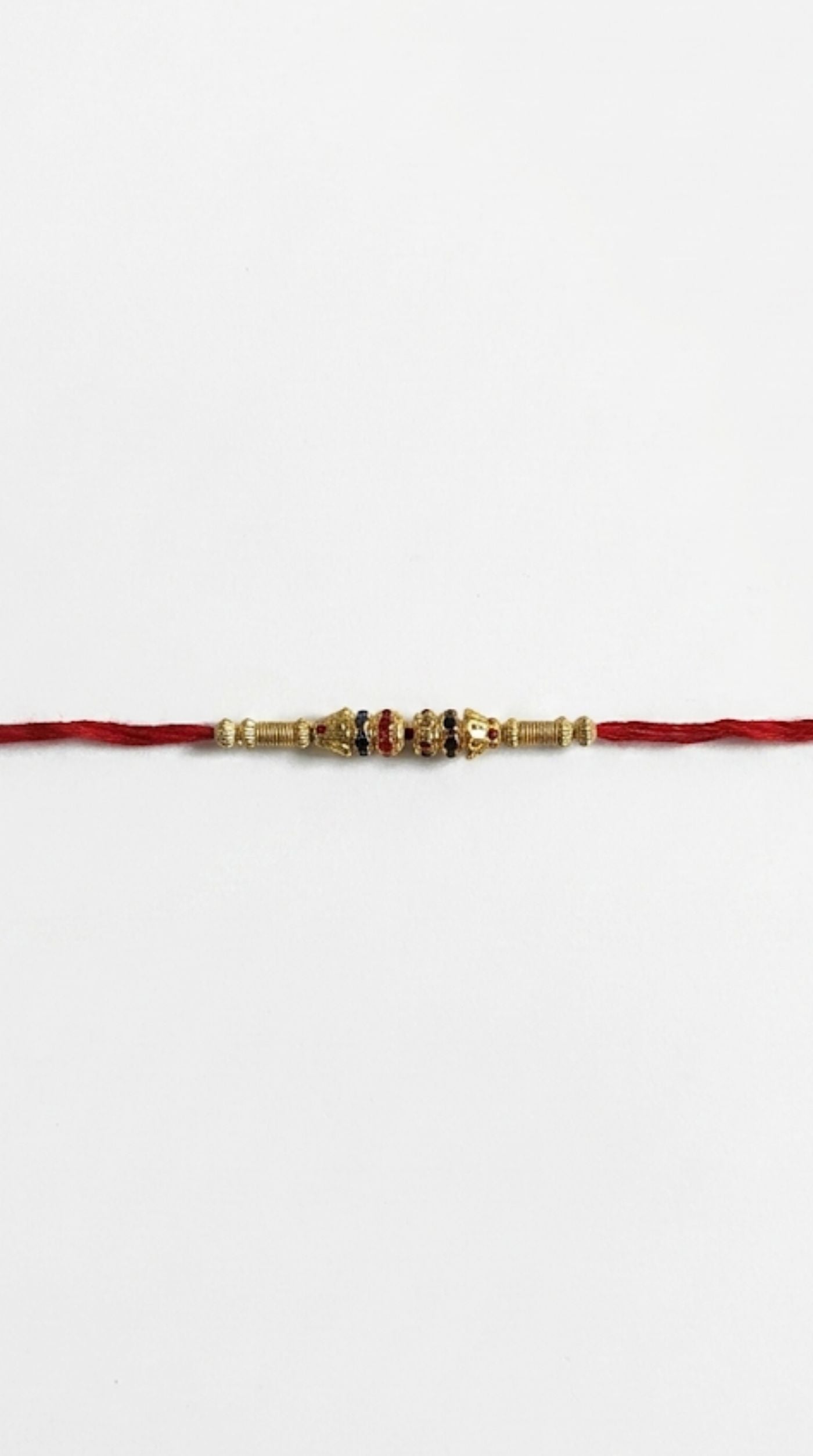 Close-up of single beaded maroon Rakhi bracelet