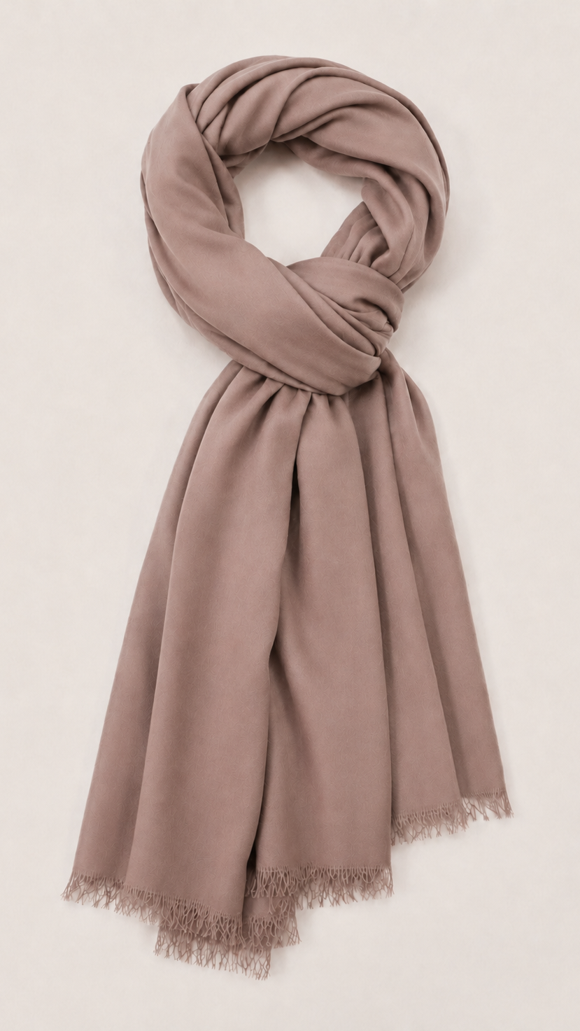 A dusty mauve-brown scarf with fringed edges.