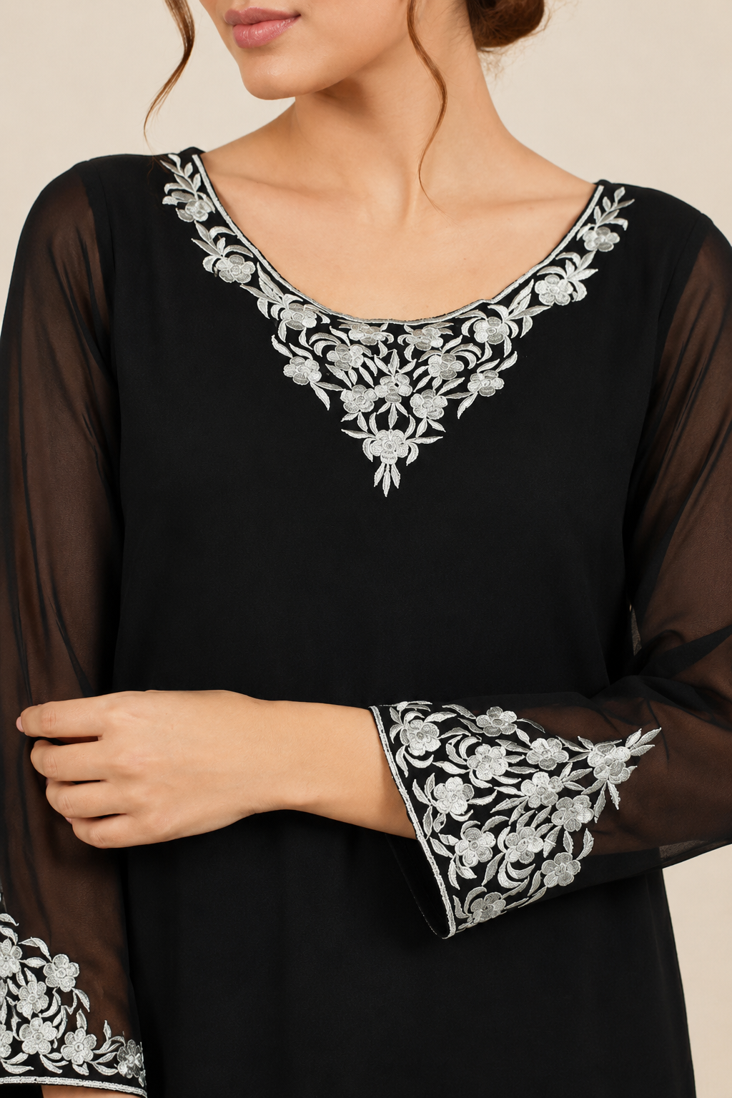 Black women’s embroidered salwar kameez suit with matching trousers, sheer chiffon dupatta and silver trim, elegant Asian ethnic wear by Diya Online