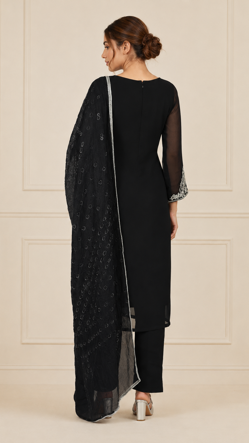 Black women’s embroidered salwar kameez suit with matching trousers, sheer chiffon dupatta and silver trim, elegant Asian ethnic wear by Diya Online