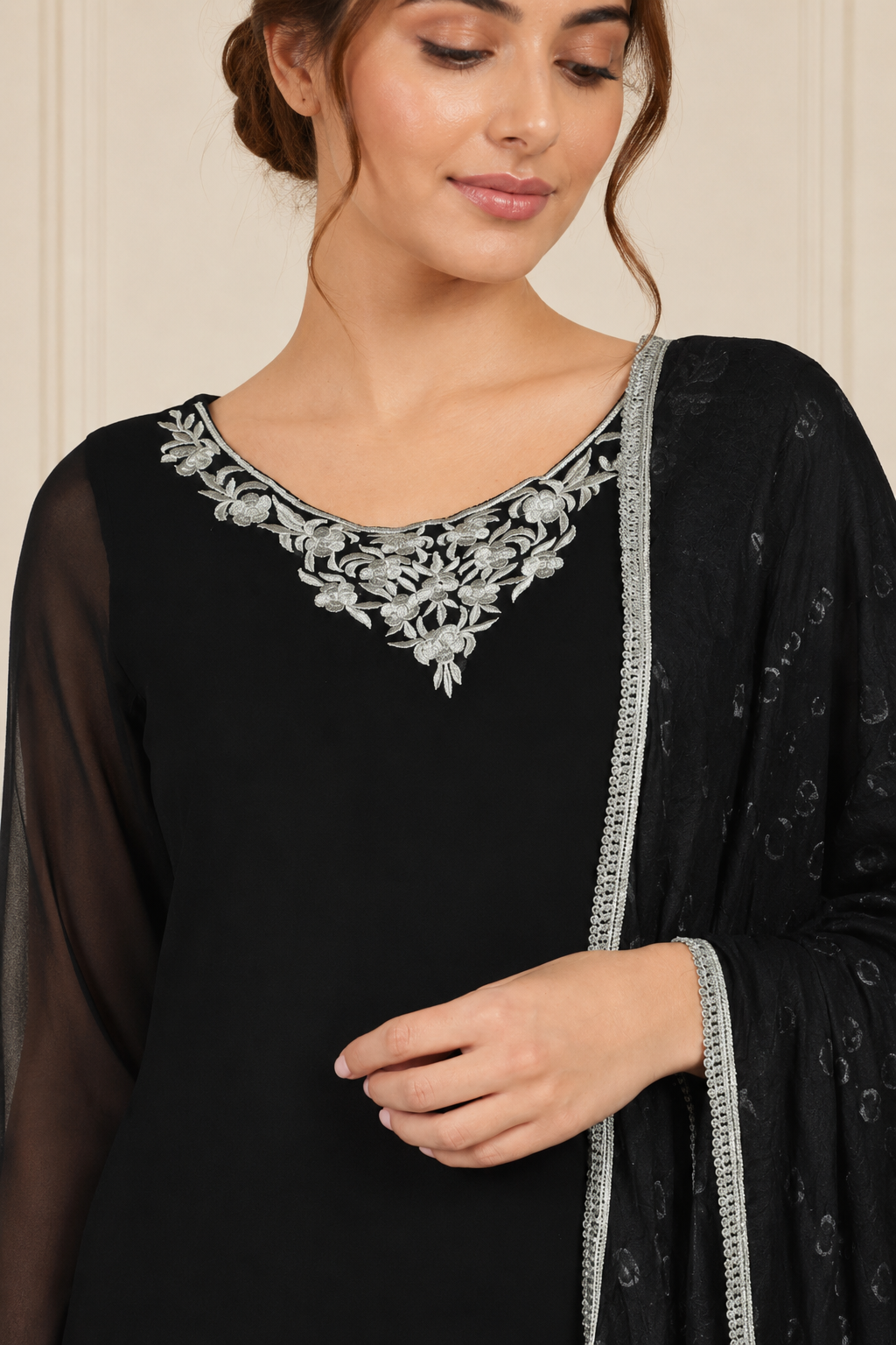 Black women’s embroidered salwar kameez suit with matching trousers, sheer chiffon dupatta and silver trim, elegant Asian ethnic wear by Diya Online