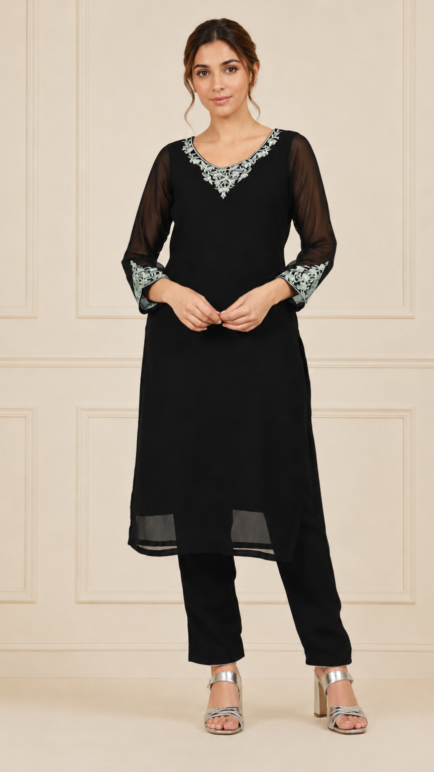 Black women’s embroidered salwar kameez suit with matching trousers, sheer chiffon dupatta and silver trim, elegant Asian ethnic wear by Diya Online