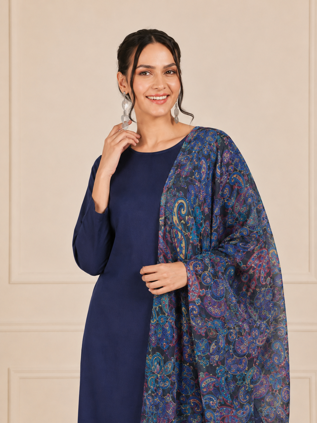 Woman wearing a navy blue kurta set with matching trousers and multicolour paisley printed dupatta – Diya Online ethnic wear.