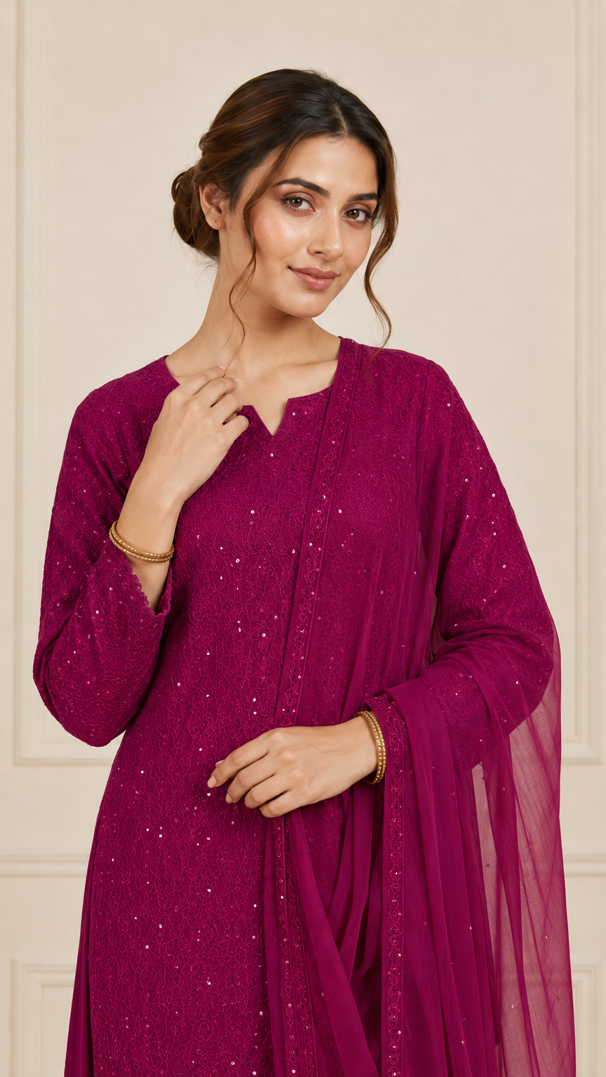 Woman wearing a deep magenta embroidered kurta set with matching salwar trousers and dupatta – Diya Online ethnic wear.