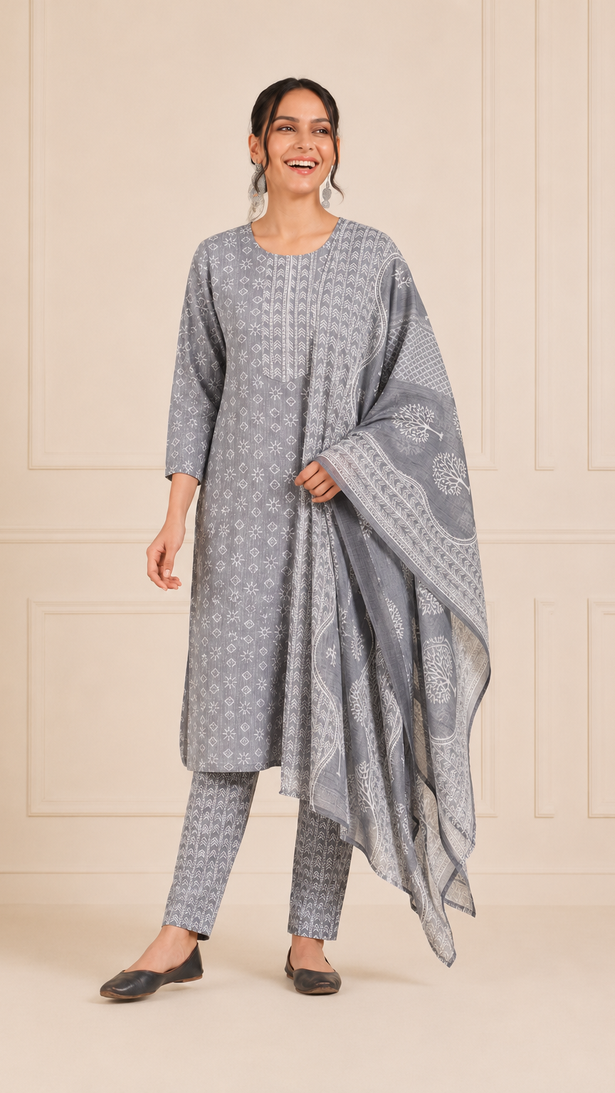 Woman wearing a grey and white printed kurta set with matching trousers and printed dupatta – Diya Online ethnic wear.