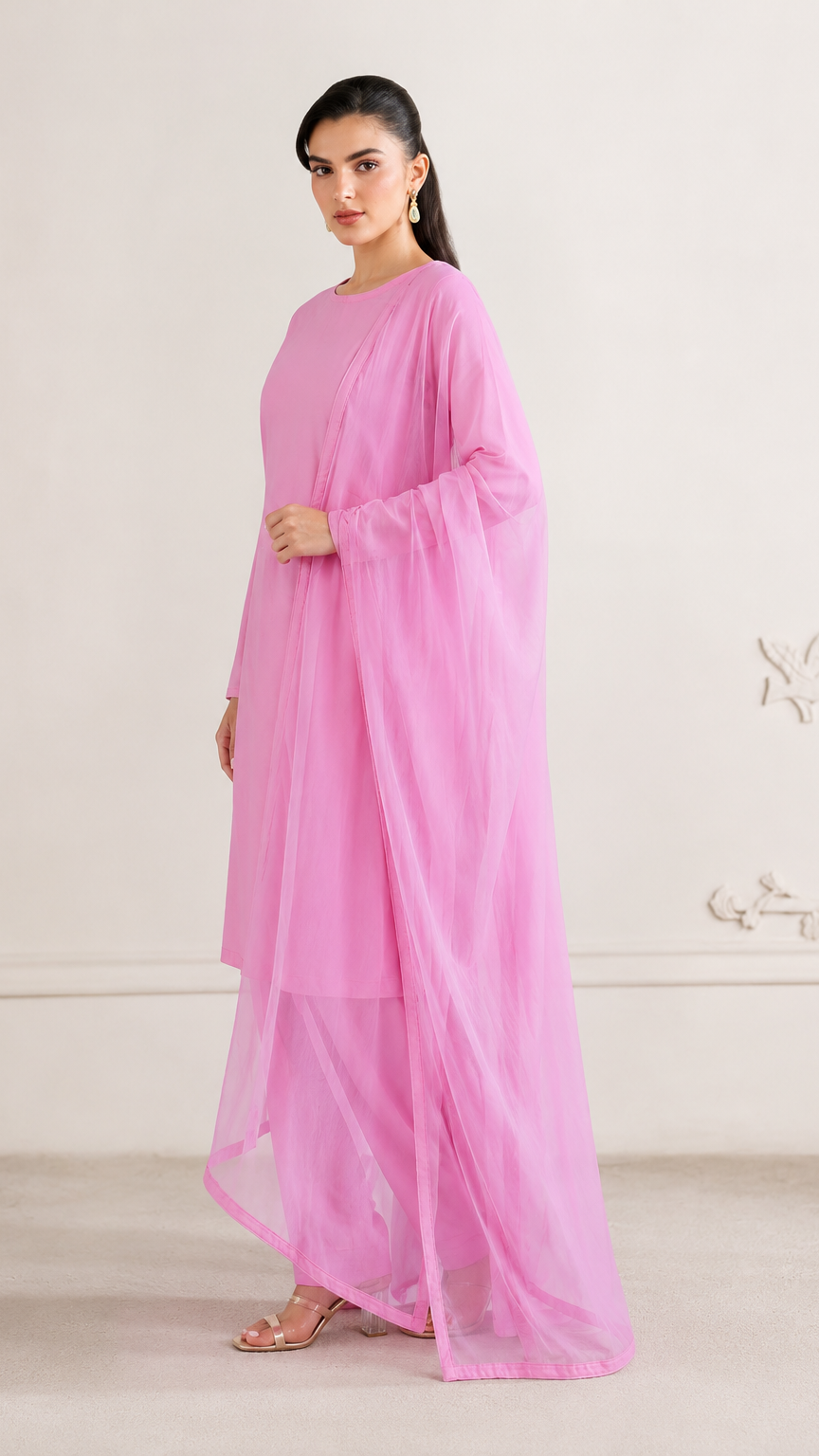 Buy bright pink plain Pakistani salwar kameez with long kurta, gathered trousers and matching sheer dupatta for women online at Diya Online