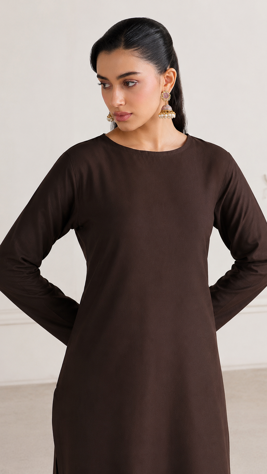 Buy plain chocolate brown Pakistani salwar kameez with long kurta, gathered trousers and matching sheer dupatta for women online at Diya Online.