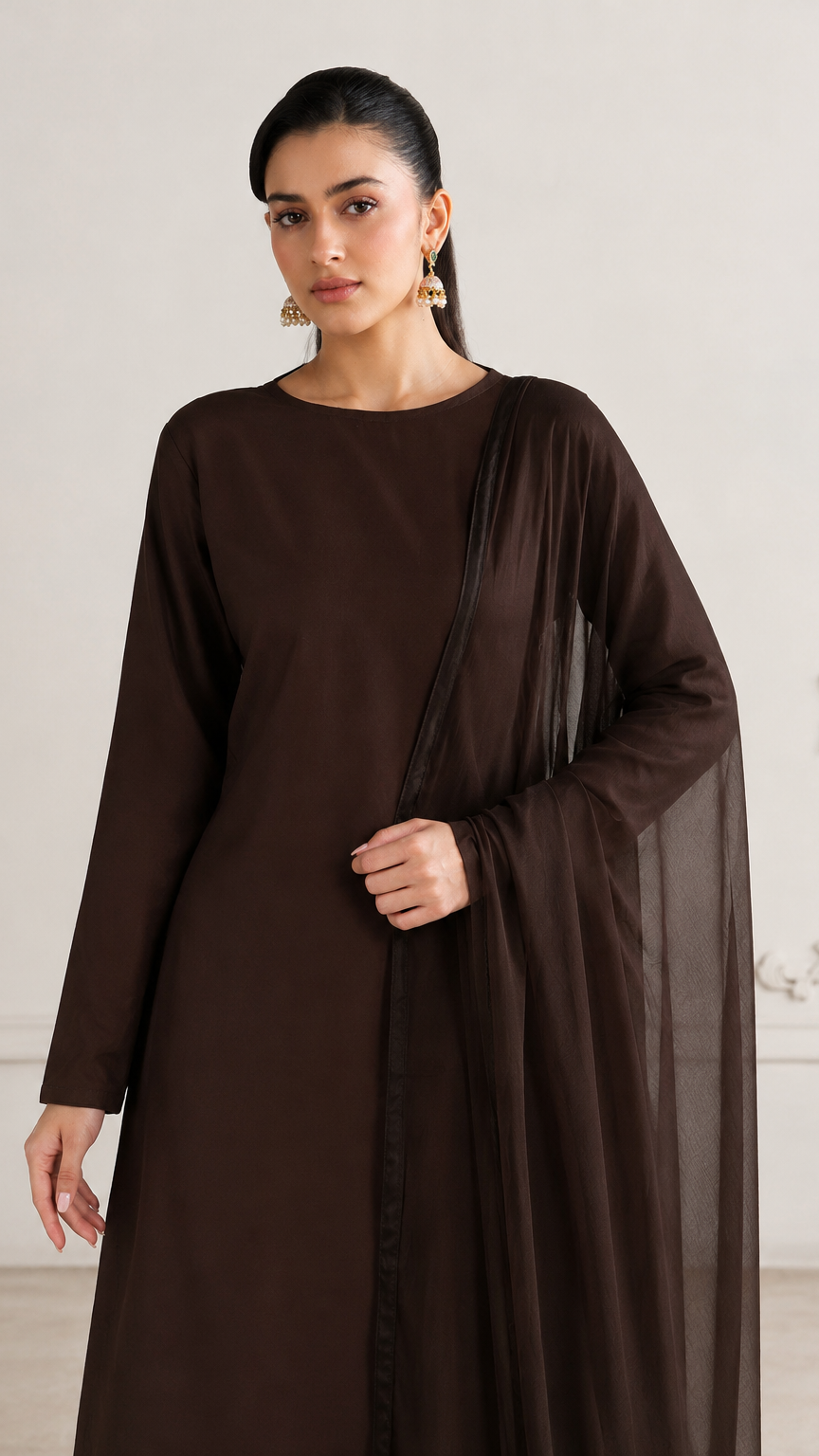 Buy plain chocolate brown Pakistani salwar kameez with long kurta, gathered trousers and matching sheer dupatta for women online at Diya Online.