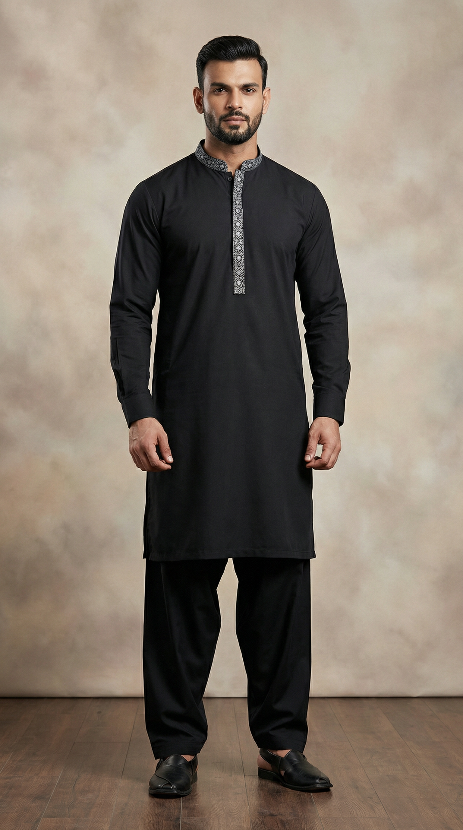 Men’s black embroidered shalwar kameez featuring premium fabric kameez with contrast embroidered neckline and matching shalwar, traditional ethnic wear for Eid, weddings, festive and formal occasions.