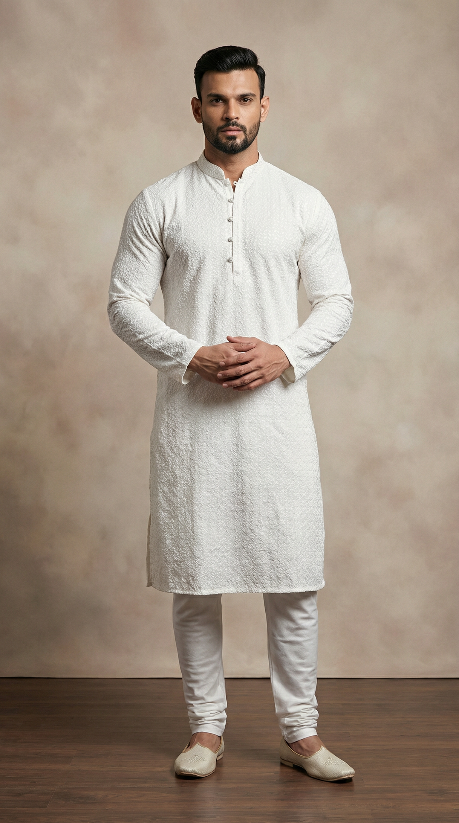 Men’s white jacquard kurta pyjama featuring premium textured fabric kurta with mandarin collar, buttoned placket, and matching white pyjama. Traditional men’s ethnic wear for weddings, Eid, festive occasions, and formal cultural events.