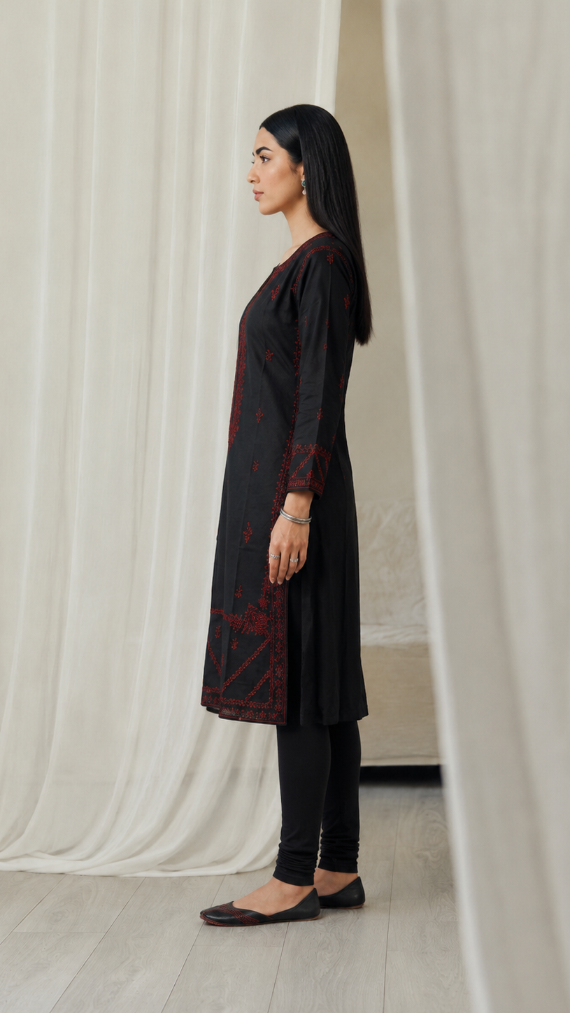 Black women’s embroidered kurta with red threadwork, keyhole neckline, long sleeves and matching black churidar leggings, modest Asian ethnic wear by Diya Online
