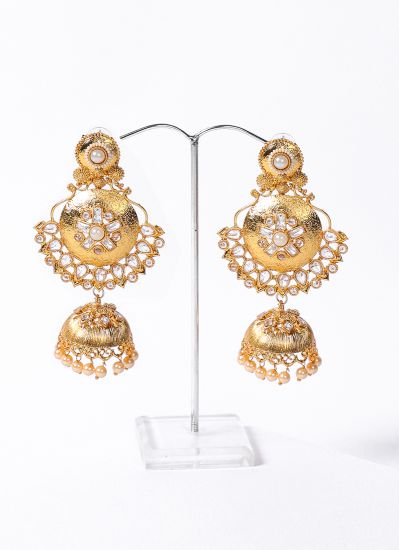 Gold earrings with white stonework
